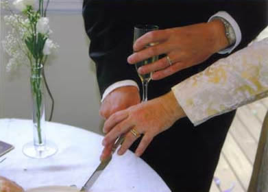 Showing the rings as we cut the cakes (yes, plural).