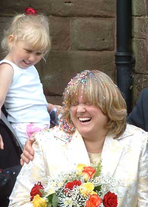 Emelye throwing confetti.
